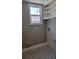A charming laundry room with utility sink, shelving, and connections for a washer and dryer at 1364 Iola St, Aurora, CO 80010