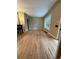 The living room features warm hardwood floors and a large window with natural light at 1364 Iola St, Aurora, CO 80010