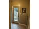 A practical mud room features a door to the backyard and a framed picture at 1364 Iola St, Aurora, CO 80010