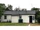 Rear exterior of the home with gray roof at 1364 Iola St, Aurora, CO 80010