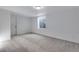Spacious basement featuring neutral walls, carpet, and a window at 3318 N Haleyville Ct, Aurora, CO 80019