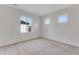 Sunny bedroom with plush carpet and multiple windows providing plenty of light at 3318 N Haleyville Ct, Aurora, CO 80019