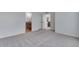 Spacious bedroom with carpeted floor, ensuite bathroom, and closet space at 3318 N Haleyville Ct, Aurora, CO 80019