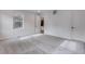 Cozy bedroom features soft carpet and open doorway with bright natural light at 3318 N Haleyville Ct, Aurora, CO 80019
