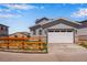 Charming two-story home with gray siding and a two-car garage at 3318 N Haleyville Ct, Aurora, CO 80019