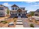 Charming two-story home with inviting front porch and professionally landscaped front yard at 3318 N Haleyville Ct, Aurora, CO 80019