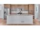 Spacious kitchen featuring large island with granite countertop and stainless steel appliances at 3318 N Haleyville Ct, Aurora, CO 80019