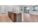 Kitchen with large island, stainless steel appliances, and sliding glass doors to the outside at 3318 N Haleyville Ct, Aurora, CO 80019