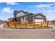 View of rear exterior featuring a fenced yard and attached two-car garage at 3318 N Haleyville Ct, Aurora, CO 80019