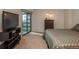 Comfortable main bedroom with balcony access and TV at 1777 Larimer St # 707, Denver, CO 80202