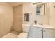 Clean bathroom with tiled shower, sleek toilet, and modern vanity for a functional space at 9544 Josephine St, Thornton, CO 80229