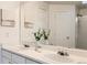 Bathroom features double sinks, a large mirror, and white cabinets at 9544 Josephine St, Thornton, CO 80229