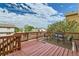A wooden deck features outdoor seating and a view of the surrounding neighborhood at 9544 Josephine St, Thornton, CO 80229
