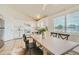 A spacious kitchen features white cabinets, stainless steel appliances, tile flooring, and an adjacent dining area at 9544 Josephine St, Thornton, CO 80229