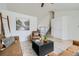 Bright living room featuring neutral walls, a ceiling fan, and a staircase to the upper level at 9544 Josephine St, Thornton, CO 80229