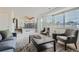 Bright living room with a dark coffee table and comfortable seating area near windows with blinds at 9544 Josephine St, Thornton, CO 80229