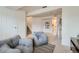 Neutral-toned living room offering cozy chairs, a play area, and access to the bathroom at 9544 Josephine St, Thornton, CO 80229
