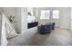 Spacious living room features cozy beanbag chairs, stylish decor, and bright natural light at 9544 Josephine St, Thornton, CO 80229