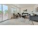 Cozy living room featuring a sliding glass door to the back deck, a console table, and plush seating at 9544 Josephine St, Thornton, CO 80229