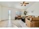 Inviting living room with a large window, ceiling fan, and neutral-toned decor, perfect for relaxing and entertaining at 9544 Josephine St, Thornton, CO 80229