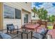 Relaxing patio with chairs, a glass table, and sliding door access to the house at 9544 Josephine St, Thornton, CO 80229