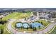 Aerial view of the community's recreational facilities, including a golf course, clubhouse and tennis courts at 23644 E Phillips Pl, Aurora, CO 80016