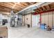 Basement features include exposed ductwork and framing, with access to other parts of the house at 23644 E Phillips Pl, Aurora, CO 80016