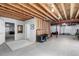 Spacious unfinished basement with visible studs, utilities, and some partially finished walls at 23644 E Phillips Pl, Aurora, CO 80016