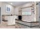 Elegant bathroom featuring a walk-in tub and shower with beautiful tile work at 23644 E Phillips Pl, Aurora, CO 80016