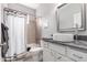 This bathroom features an oversized sink, dark countertops and a shower-tub combination at 23644 E Phillips Pl, Aurora, CO 80016