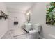 This bathroom features a glass sink, modern finishes and marble floors at 23644 E Phillips Pl, Aurora, CO 80016