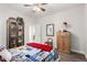 This bedroom features hardwood floors, unique decor and a cabinet for storage at 23644 E Phillips Pl, Aurora, CO 80016