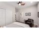 This bedroom features a ceiling fan, hardwood floors and a closet with sliding doors at 23644 E Phillips Pl, Aurora, CO 80016