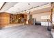 Spacious garage featuring ample storage, work area, and pegboard wall for tool organization at 23644 E Phillips Pl, Aurora, CO 80016