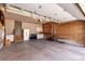 Well-organized garage with custom wood slat walls, work bench, and plenty of room for storage at 23644 E Phillips Pl, Aurora, CO 80016