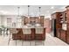 Open kitchen featuring an island with bar stool seating, and stainless appliances at 23644 E Phillips Pl, Aurora, CO 80016