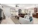 Cozy living room with wood floors, a fireplace, neutral colors, and an open floorplan at 23644 E Phillips Pl, Aurora, CO 80016