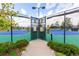 View of the entrance to the community tennis courts with well-maintained fencing and gate at 23644 E Phillips Pl, Aurora, CO 80016