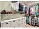 Organized walk-in closet with shelving, hanging racks, and storage baskets at 23644 E Phillips Pl, Aurora, CO 80016