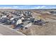 Aerial view of home and community with tidy landscaping and mountain views at 1110 Black Saddle St, Elizabeth, CO 80107