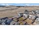 Aerial view of homes featuring fenced yards, walkout decks, and open space at 1110 Black Saddle St, Elizabeth, CO 80107