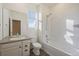 Well-lit bathroom featuring a vanity, toilet, and shower-tub combination at 1110 Black Saddle St, Elizabeth, CO 80107