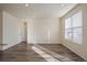 Bright living room featuring hardwood floors, neutral walls, and lots of natural light at 1110 Black Saddle St, Elizabeth, CO 80107