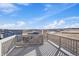 Scenic view from a deck overlooking a neighborhood, open fields, and a bright blue sky at 1110 Black Saddle St, Elizabeth, CO 80107