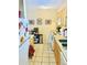Efficient kitchen featuring light wood cabinetry, tile floors, and stainless steel oven at 2500 S York St # 213, Denver, CO 80210