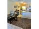 Cozy living space with dining area, open kitchen and neutral tones at 2500 S York St # 213, Denver, CO 80210
