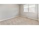 Bedroom featuring a window and light walls at 13497 Valentia St, Thornton, CO 80602