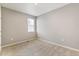 Neutral bedroom with carpet flooring, window, and light-colored walls at 13497 Valentia St, Thornton, CO 80602