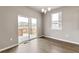 Bright dining area with sliding glass doors to outdoor deck at 13497 Valentia St, Thornton, CO 80602