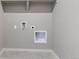 Laundry room with tile flooring and wall hookups at 13497 Valentia St, Thornton, CO 80602